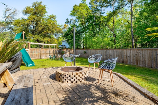 1606 Stovall Ct, Johns Island, SC 29455 - view of patio / terrace with a fire pit, a fenced backyard, and a playground