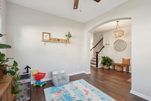1606 Stovall Ct, Johns Island, SC 29455 - interior space with stairway, wood finished floors, ceiling fan with notable chandelier, arched walkways, and baseboards