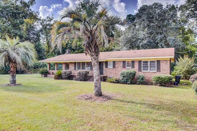 single story home with a front yard