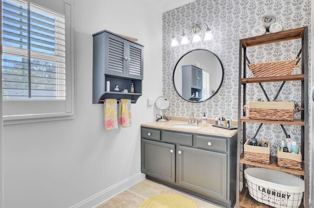 bathroom featuring baseboards, wallpapered walls, vanity, and tile patterned floors