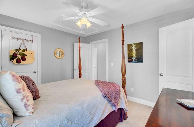 bedroom featuring carpet floors, baseboards, attic access, and ceiling fan