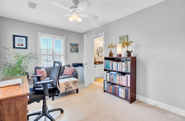 office with baseboards, visible vents, ceiling fan, and carpet flooring