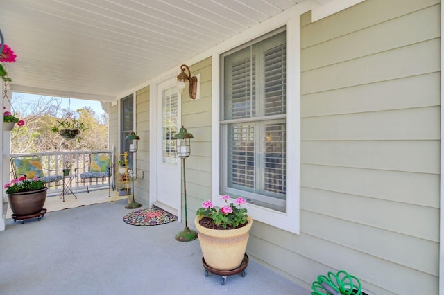 doorway to property featuring covered porch