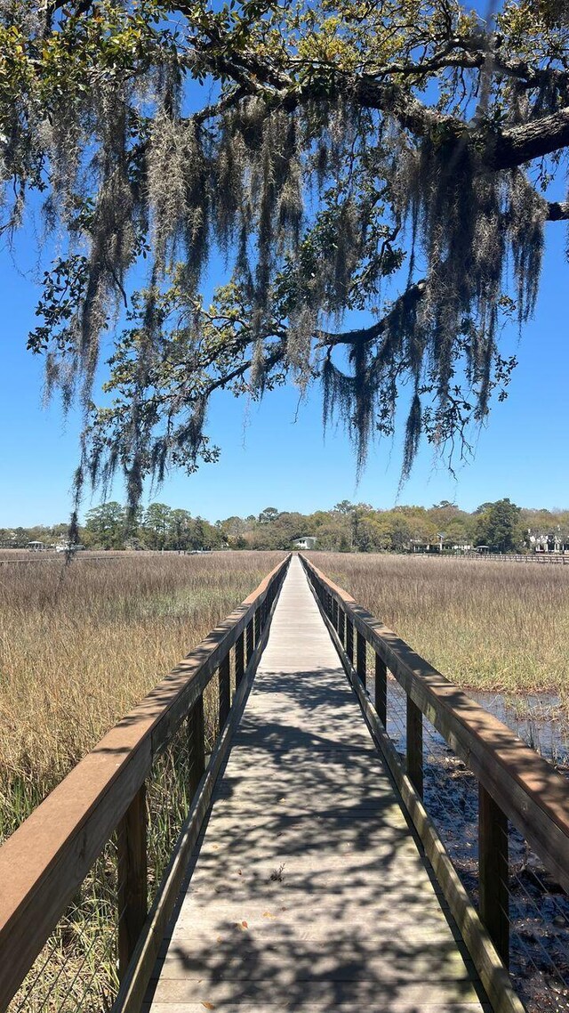view of dock with a rural view