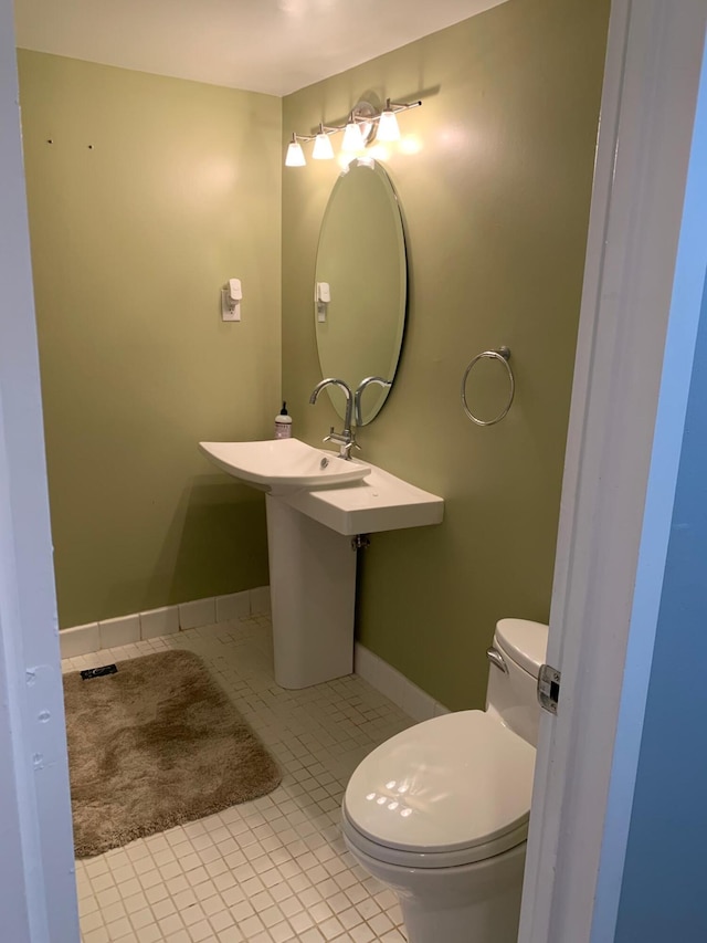 bathroom featuring toilet and tile patterned floors