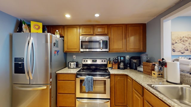 kitchen with appliances with stainless steel finishes and sink