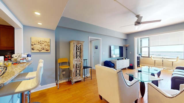 interior space with ceiling fan and hardwood / wood-style flooring