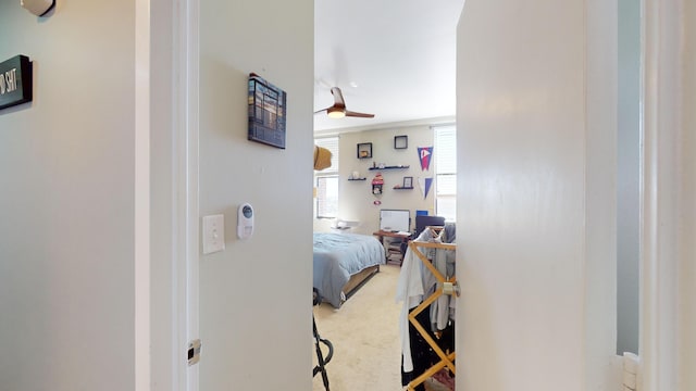 carpeted bedroom with ceiling fan