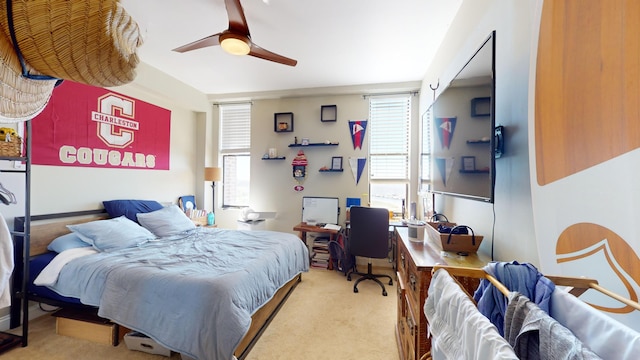 bedroom featuring ceiling fan and light carpet