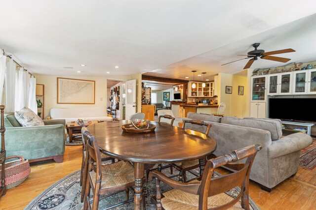 dining area featuring ceiling fan and light hardwood / wood-style floors