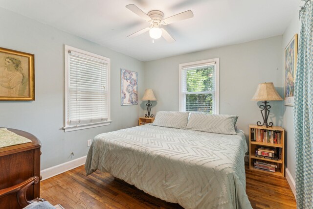 bedroom with dark wood-type flooring and ceiling fan