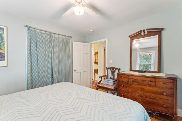 bedroom with ceiling fan and hardwood / wood-style floors