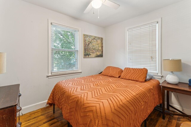 bedroom featuring ceiling fan and dark hardwood / wood-style floors