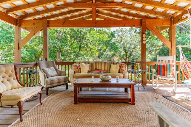 view of patio featuring an outdoor living space, a wooden deck, and a gazebo