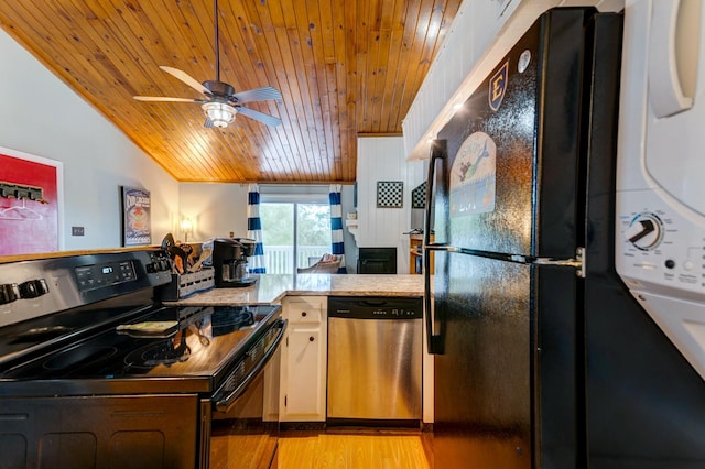 kitchen featuring ceiling fan, stacked washing maching and dryer, black appliances, wooden ceiling, and light wood-type flooring