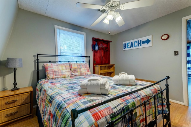 bedroom featuring light hardwood / wood-style flooring and ceiling fan