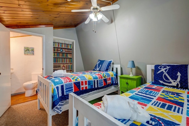 carpeted bedroom featuring lofted ceiling, connected bathroom, wooden ceiling, and ceiling fan