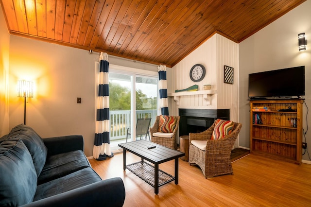 living room featuring lofted ceiling, wood ceiling, ornamental molding, and light wood-type flooring