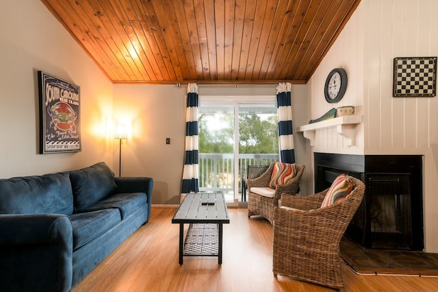 living room with lofted ceiling, light wood-type flooring, and wood ceiling