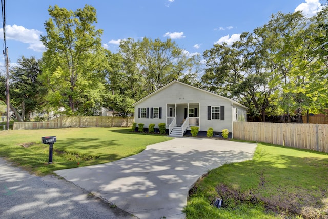 view of front of house featuring covered porch and a front yard