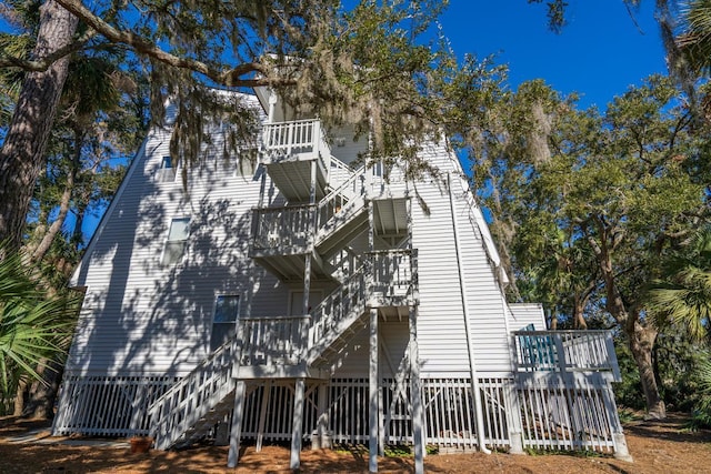 view of home's exterior with a balcony