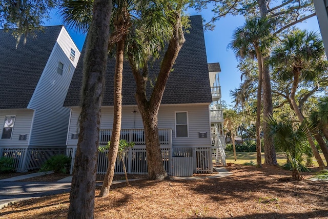 view of side of home with a balcony