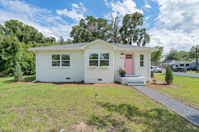 1312 Congress St, Beaufort, SC 29902 - view of front facade featuring a front yard, crawl space, and stucco siding