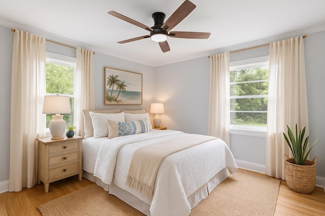 1312 Congress St, Beaufort, SC 29902 - bedroom with light wood finished floors, ceiling fan, and crown molding