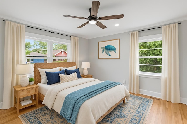 1312 Congress St, Beaufort, SC 29902 - bedroom with light wood-style flooring, recessed lighting, and ceiling fan