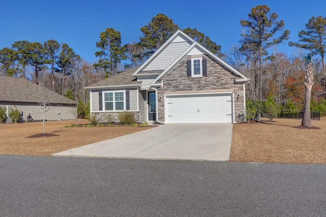 craftsman house with a garage, stone siding, and concrete driveway