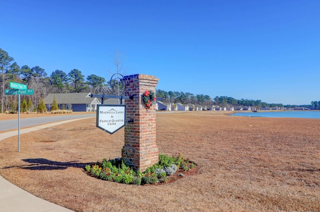 surrounding community featuring a water view