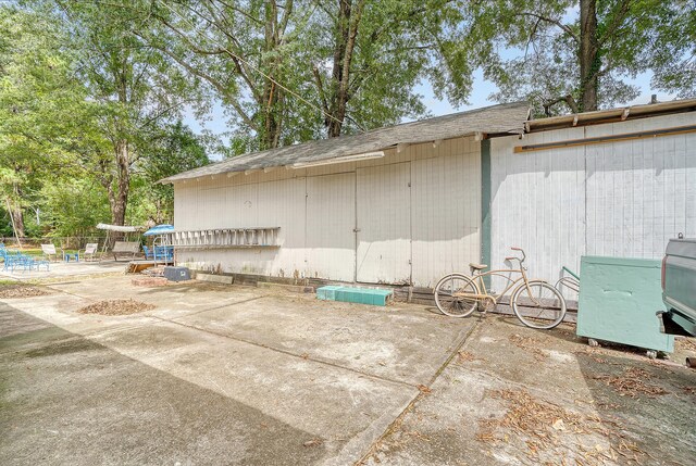 view of property exterior with a patio