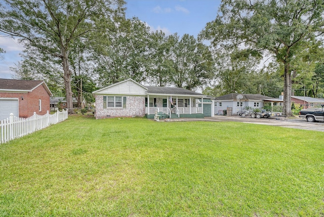 back of property with a yard, a garage, a carport, and a porch