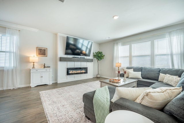 705 Squire Pope Rd, Summerville, SC 29486 - living area featuring plenty of natural light, wood finished floors, and baseboards