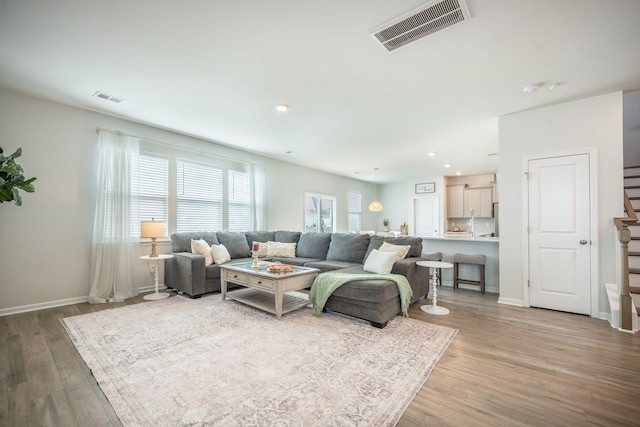 705 Squire Pope Rd, Summerville, SC 29486 - living room featuring wood finished floors, recessed lighting, stairs, and baseboards
