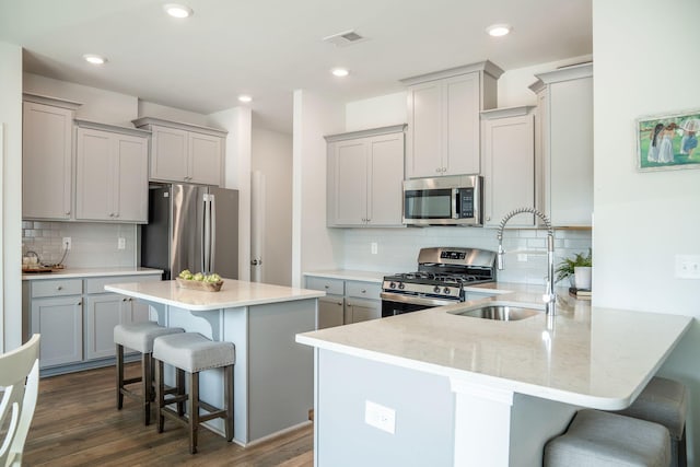 705 Squire Pope Rd, Summerville, SC 29486 - kitchen with stainless steel appliances, gray cabinets, and recessed lighting