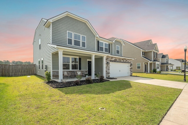 705 Squire Pope Rd, Summerville, SC 29486 - view of front facade featuring a porch, driveway, an attached garage, and stone siding