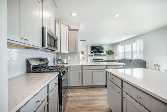 705 Squire Pope Rd, Summerville, SC 29486 - kitchen featuring appliances with stainless steel finishes, a sink, gray cabinetry, and recessed lighting