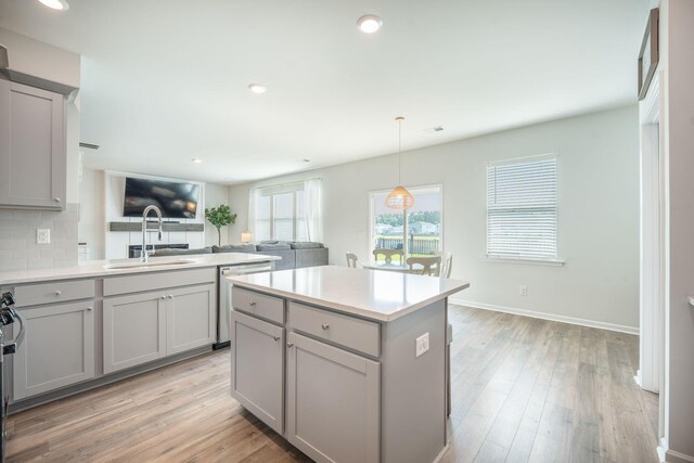 705 Squire Pope Rd, Summerville, SC 29486 - kitchen with gray cabinetry, stainless steel dishwasher, a sink, open floor plan, and recessed lighting