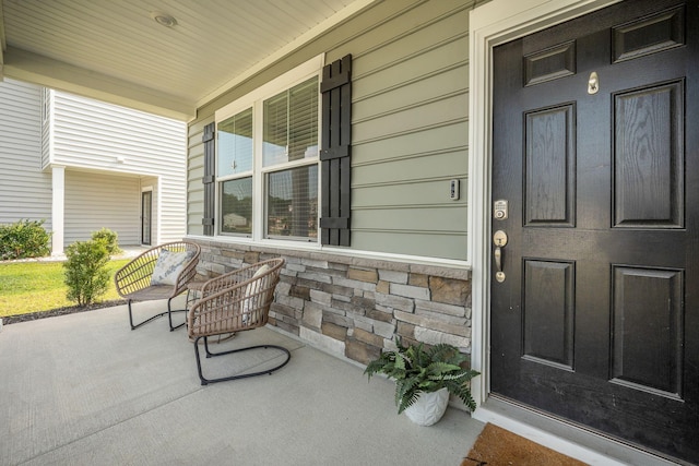 705 Squire Pope Rd, Summerville, SC 29486 - view of exterior entry featuring a porch and stone siding