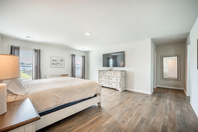 705 Squire Pope Rd, Summerville, SC 29486 - bedroom featuring multiple windows, wood finished floors, baseboards, and recessed lighting