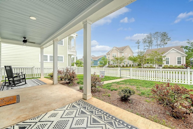view of patio / terrace with a residential view, a porch, fence, and ceiling fan
