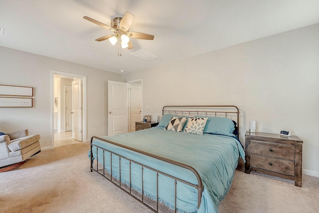 bedroom with carpet flooring, visible vents, baseboards, and ceiling fan