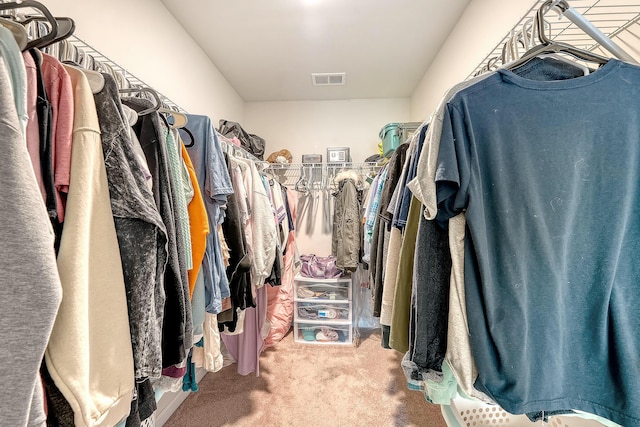 walk in closet featuring carpet floors and visible vents