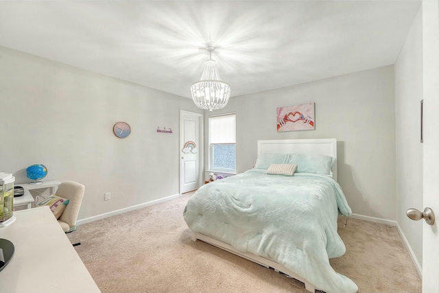 bedroom featuring baseboards, carpet flooring, and a notable chandelier