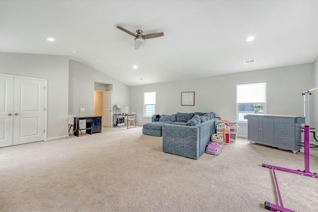 living room featuring visible vents, recessed lighting, vaulted ceiling, and light carpet