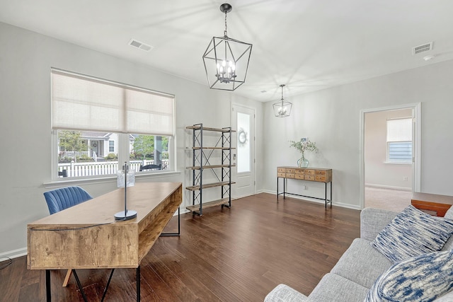 office with a chandelier, wood finished floors, baseboards, and visible vents