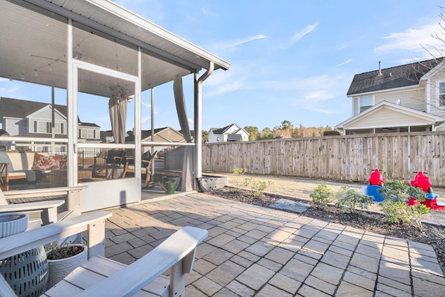 view of patio / terrace with a sunroom