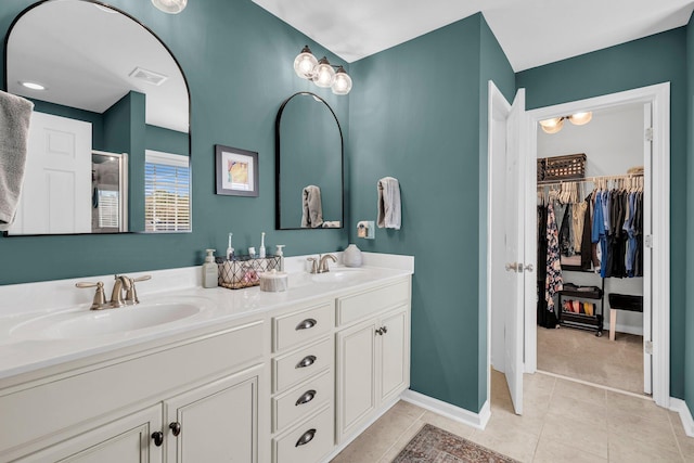 bathroom with vanity and tile patterned flooring