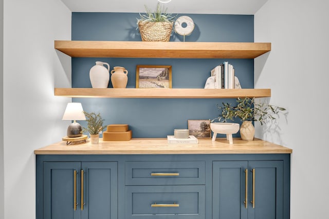 bar with blue cabinetry